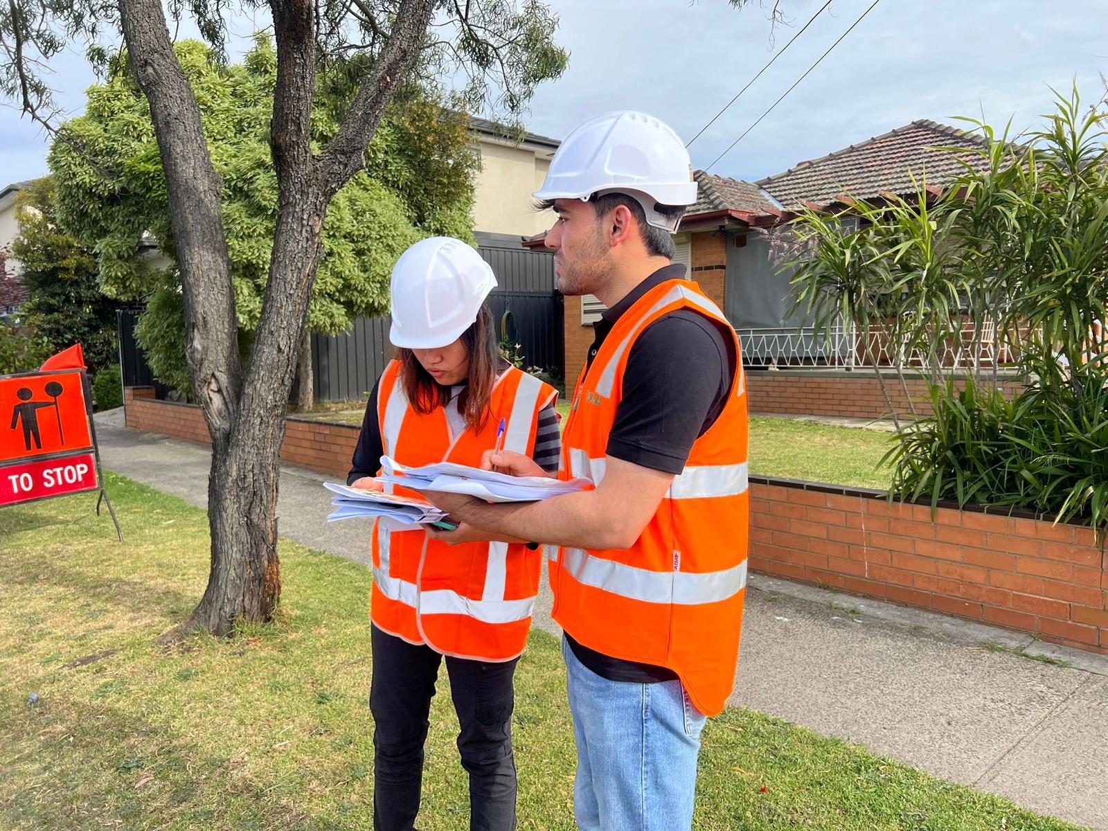 Geoporte engineers reviewing drawings on site